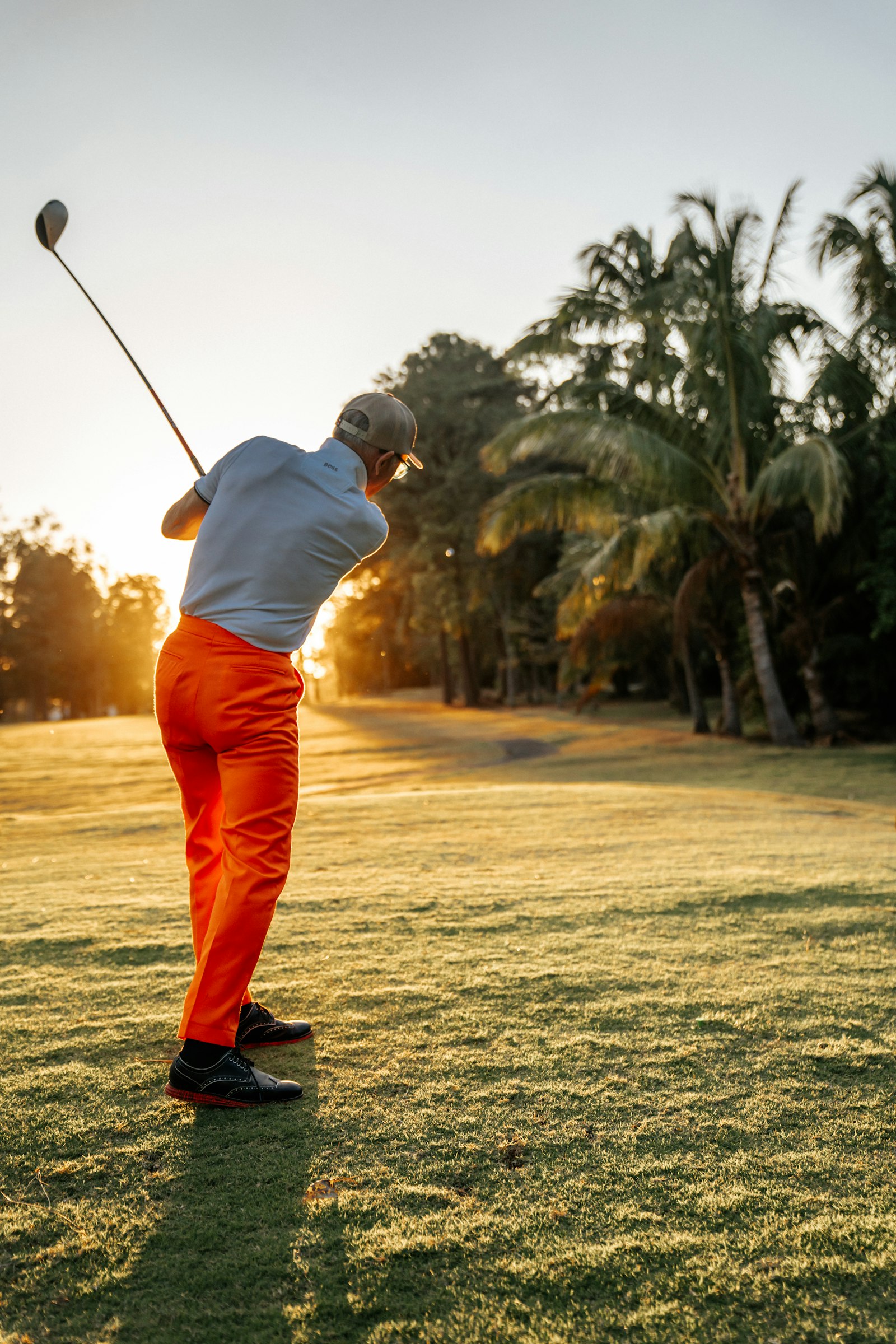 Golfer preparing to swing on a golf course